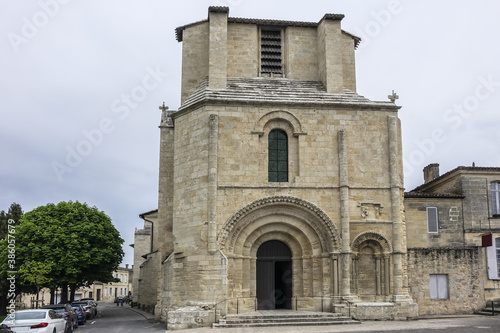 XII century Romanesque style Eglise Collegiale on St Emilion’s Place Pierre Meyrat. SAINT-EMILION, BORDEAUX, FRANCE. April 14, 2019.