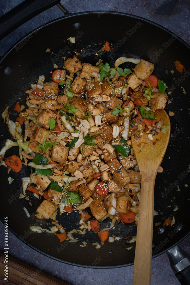 Vegan tofu, cabbage and peper stirfry in wok