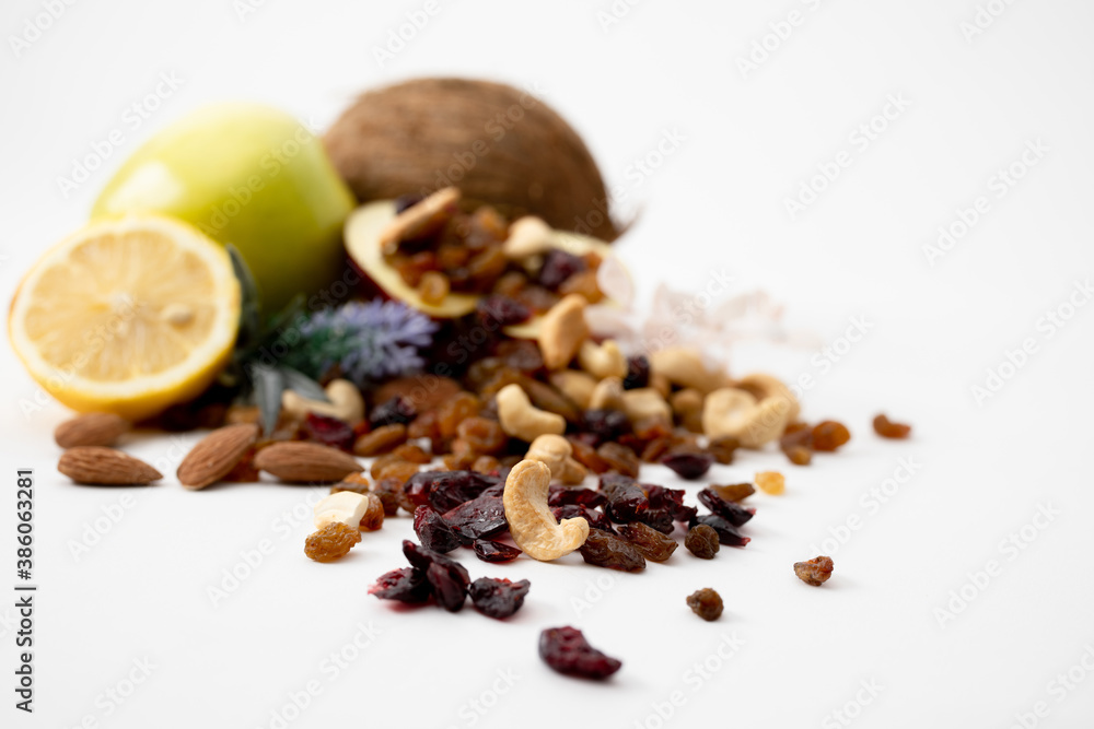 Fototapeta premium decoration with apple, almond, cashew, raisins, coconut, lemon and healthy life healthy food organic food middle