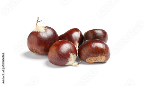 Fresh sweet edible chestnuts on white background © New Africa
