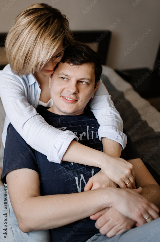 Man and woman hugging and having fun on the couch Man and woman hugging and having fun on the couch