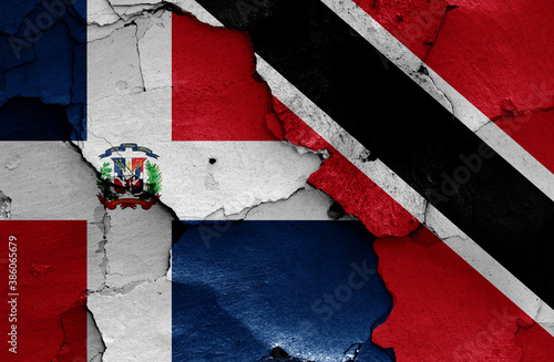 flags of Dominican Republic and Trinidad and Tobago painted on cracked wall photo