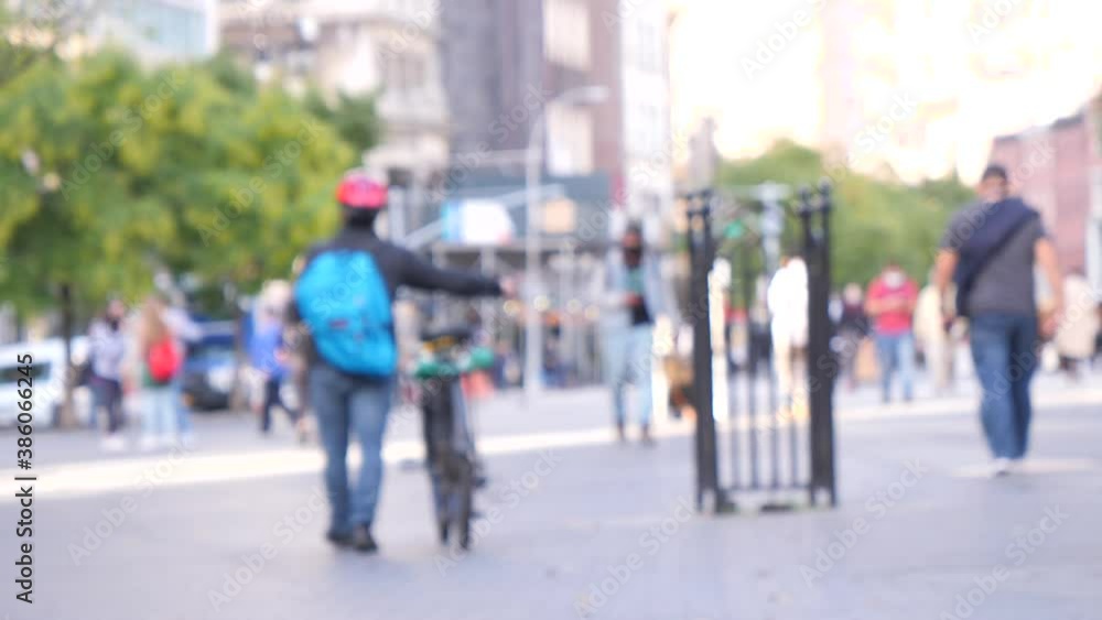 unrecognized blurry image of NYC, people walking to go shopping and commuting unrecognized blurry image of NYC, people walking to go shopping and commuting