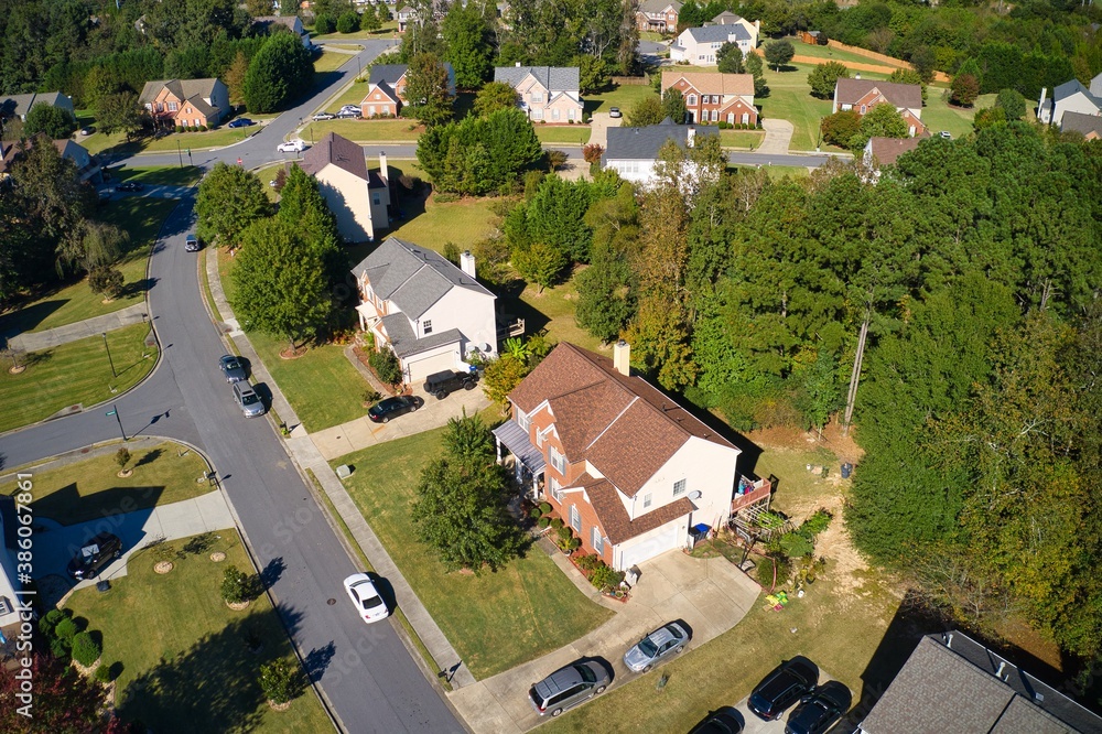 Fototapeta premium Beautiful aerial view of an upscale sub division in suburbs shot during the golden hour