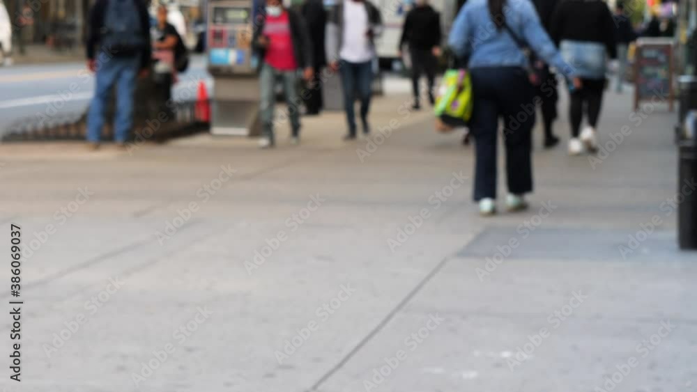 unrecognized blurry image of NYC, people walking to go shopping and commuting at nine weather day unrecognized blurry image of NYC, people walking to go shopping and commuting at nine weather day