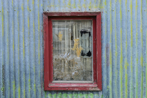 Typical old patagonian window with broken glass,Jaramillo, Argentina photo