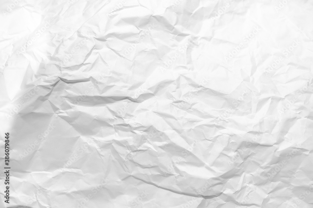Naklejka premium white and gray crumpled paper texture background. crush paper so that it becomes creased and wrinkled.
