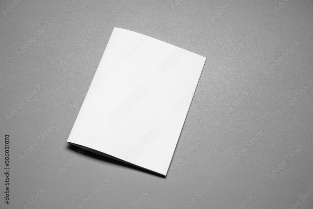 Blank portrait mock-up paper. brochure magazine isolated on gray, changeable background / white paper isolated on gray Blank portrait mock-up paper. brochure magazine isolated on gray, changeable background / white paper isolated on gray