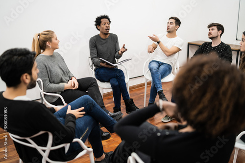Multiethnic creative people having a brainstorming meeting.