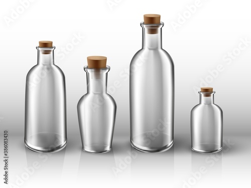 3d realistic vector transparent glass bottles set.
