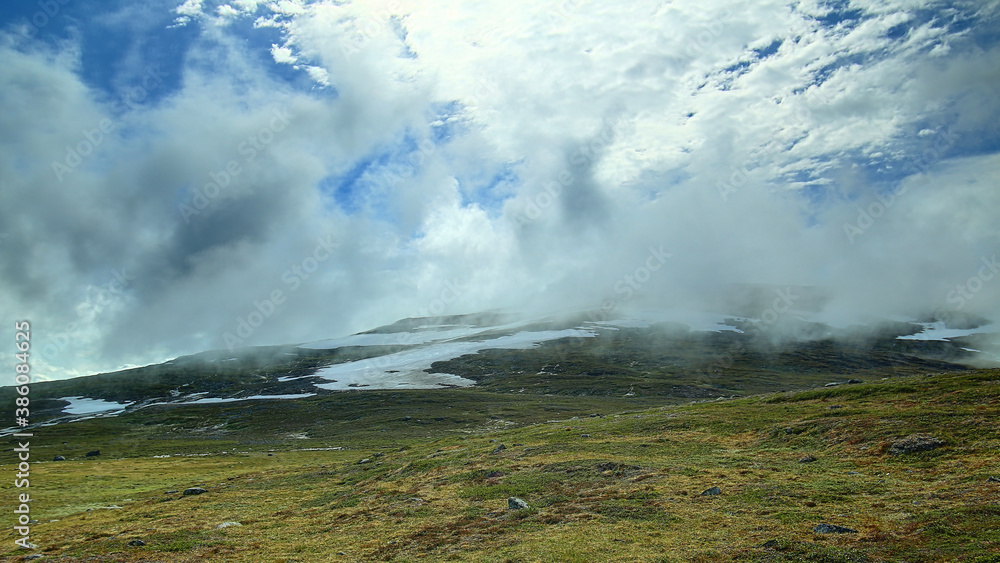 The fog on mount Nuolja is slowly lifting The fog on mount Nuolja is slowly lifting