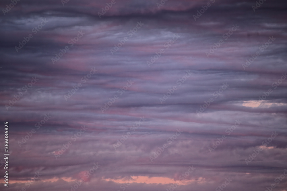 Obraz premium Impressive cloudscape, lightly illuminated by the sun below
