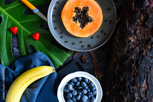 Healthy snacks and hearts on tropical beach background set up photo