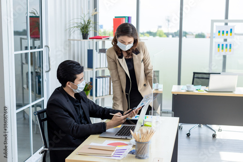 Business and social distances sit at the same tables with plastic screens reduce the coronavirus outbreak during work talks.