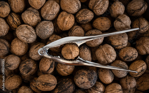 Nutcracker and walnuts. Top view image.