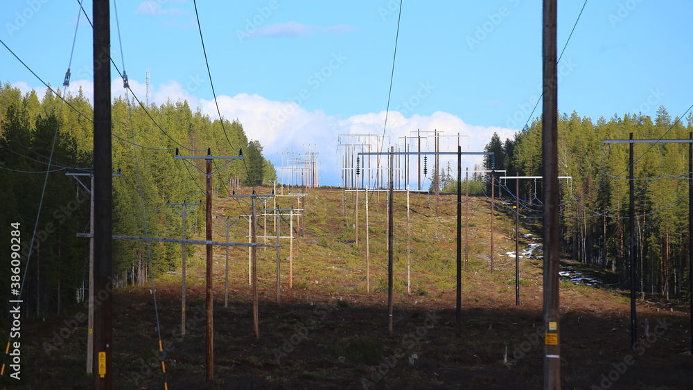 Power lines leading over Finnberget in Vasterbotten, Northern Sweden