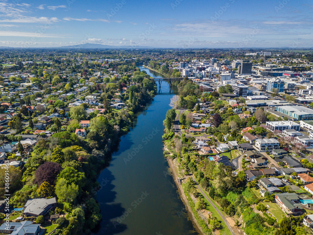 Aerial drone view over the Waikato River as it cuts through the city of Hamilton, in the Waikato region of New Zealand