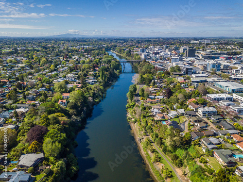 Aerial drone view over the Waikato River as it cuts through the city of Hamilton, in the Waikato region of New Zealand