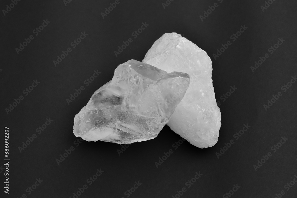 White alum cubes on black background, concept for applying underarms to reduce body odor and swing the cloudy water into the sediment. White alum cubes on black background, concept for applying underarms to reduce body odor and swing the cloudy water into the sediment.