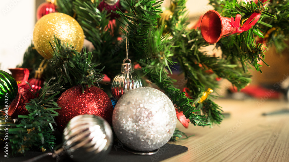 Horizontal image close up and selective focus red wrinkle Christmas ball hanging on Christmas tree for celebrate Horizontal image close up and selective focus red wrinkle Christmas ball hanging on Christmas tree for celebrate