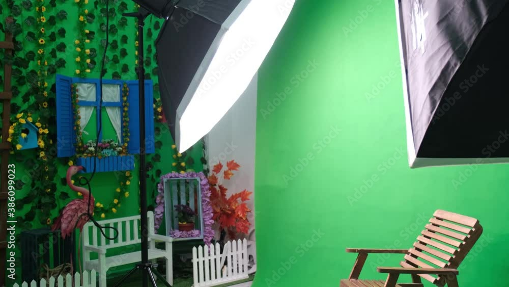 Photo or video studio with two hexagone studio lights. Green screen and fixed chair Photo or video studio with two hexagone studio lights. Green screen and fixed chair
