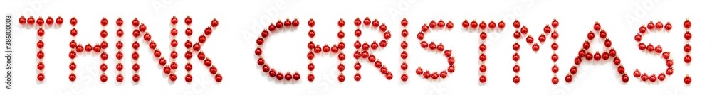 Red Christmas Ball Ornament Building English Word Think Christmas. Festive Christmas Decoration. White Isolated Background Red Christmas Ball Ornament Building English Word Think Christmas. Festive Christmas Decoration. White Isolated Background
