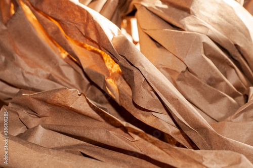 crumpled strips of a brown packing paper
