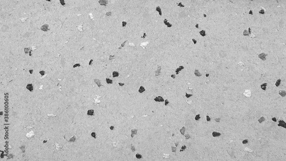 Gray with Textured small gravel or pebble wall for background in black and white tone. Grey tile floor or wallpaper and Art abstract concept Gray with Textured small gravel or pebble wall for background in black and white tone. Grey tile floor or wallpaper and Art abstract concept