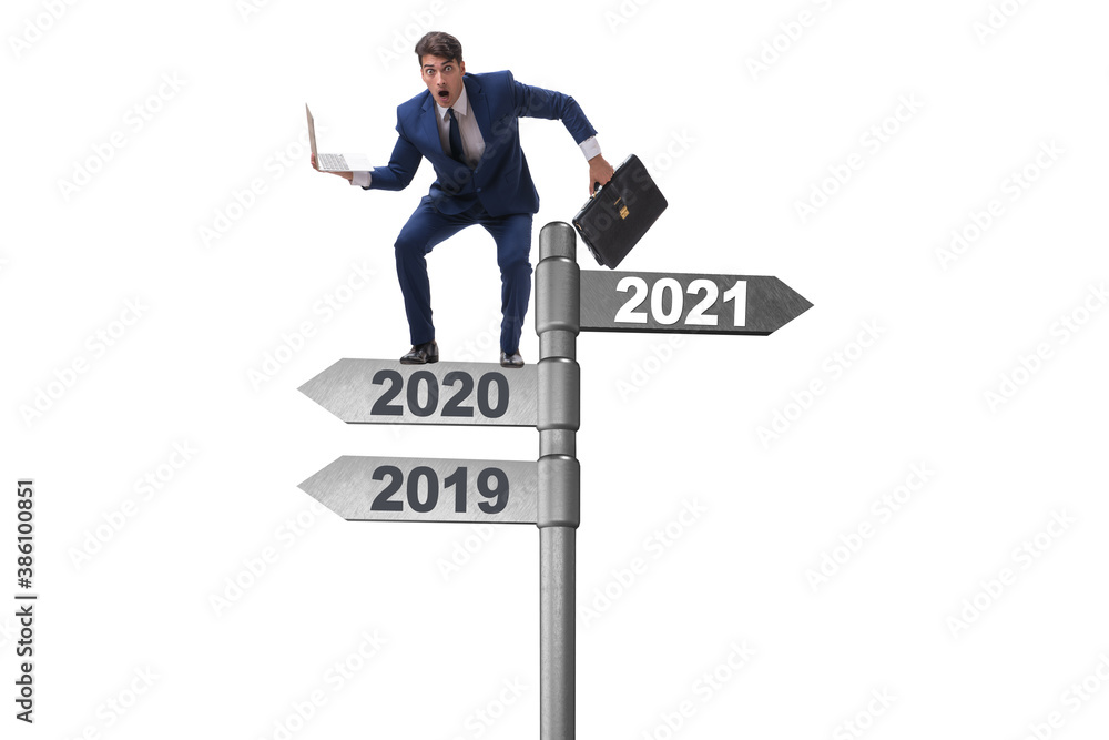 Road sign and businessman with 2020 and 2021 Road sign and businessman with 2020 and 2021