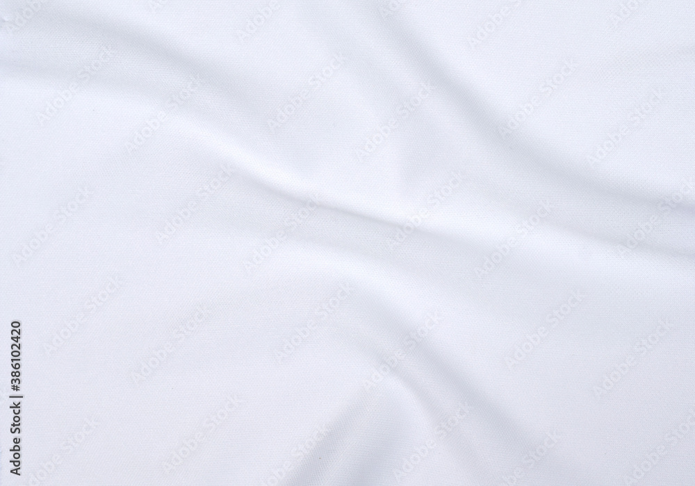 The soft wrinkles of the white cloth