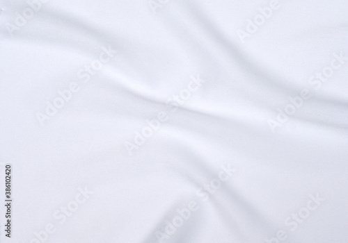 The soft wrinkles of the white cloth