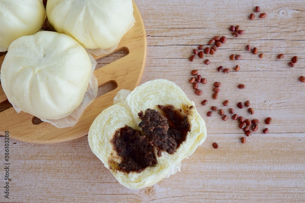 Asian steamed bun with red bean paste filling or Bakpao