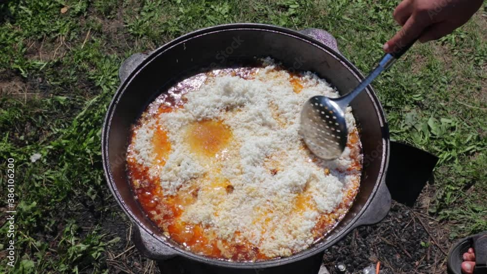 pilaf in a cauldron oriental dish on live fire pilaf in a cauldron oriental dish on live fire