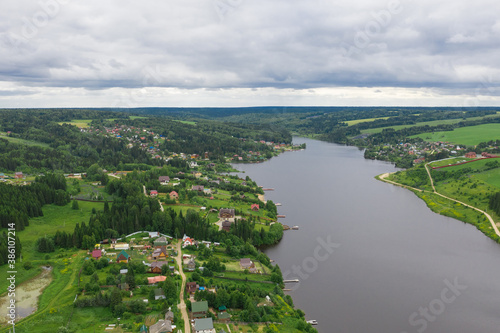 Fototapeta Naklejka Na Ścianę i Meble -  Aerial view of the Khokhlovka on the river of Kama. Perm Krai, Russia. River mouth, a village in Russia.