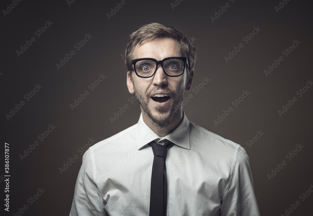 Surprised man staring at camera with amazement Surprised man staring at camera with amazement