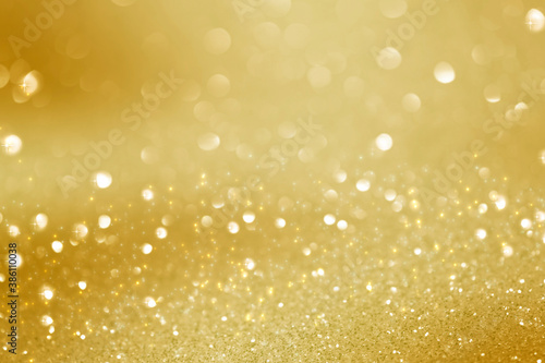 abstract defocused lights, sparkling holiday bokeh background with golden tones, elegant christmas backdrop