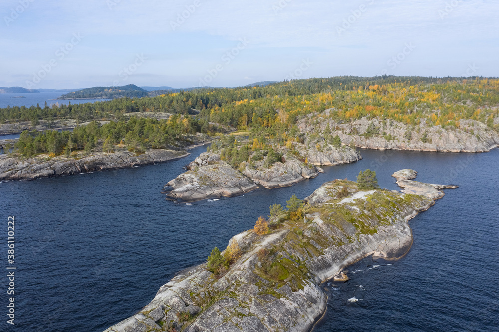 Fototapeta premium Panorama of Karelia on a Sunny day. View of Karelia from a height. nature of Russia. lake Ladoga. Islands in lake Ladoga. Trip to Russia.