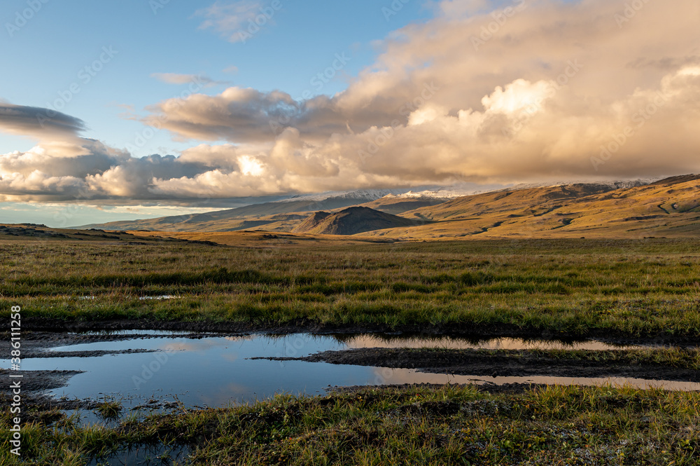 Amazing, stunning landscape of the sunset sky against the background of hills and open space, Kamchatka, Russia