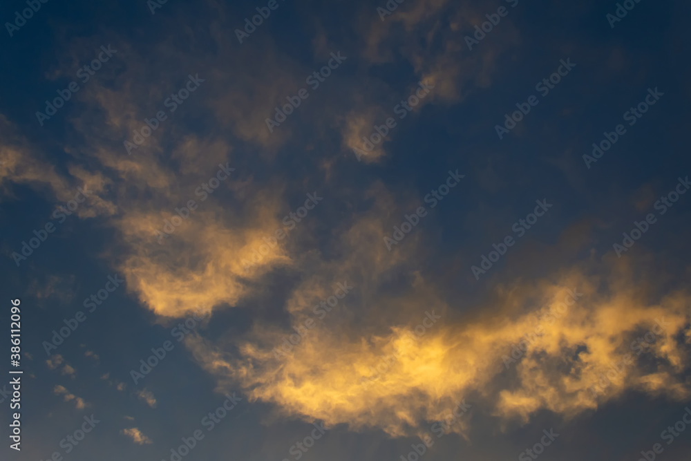 Beautiful cloud at sunset. Close-up. Backgrounds. Textures.