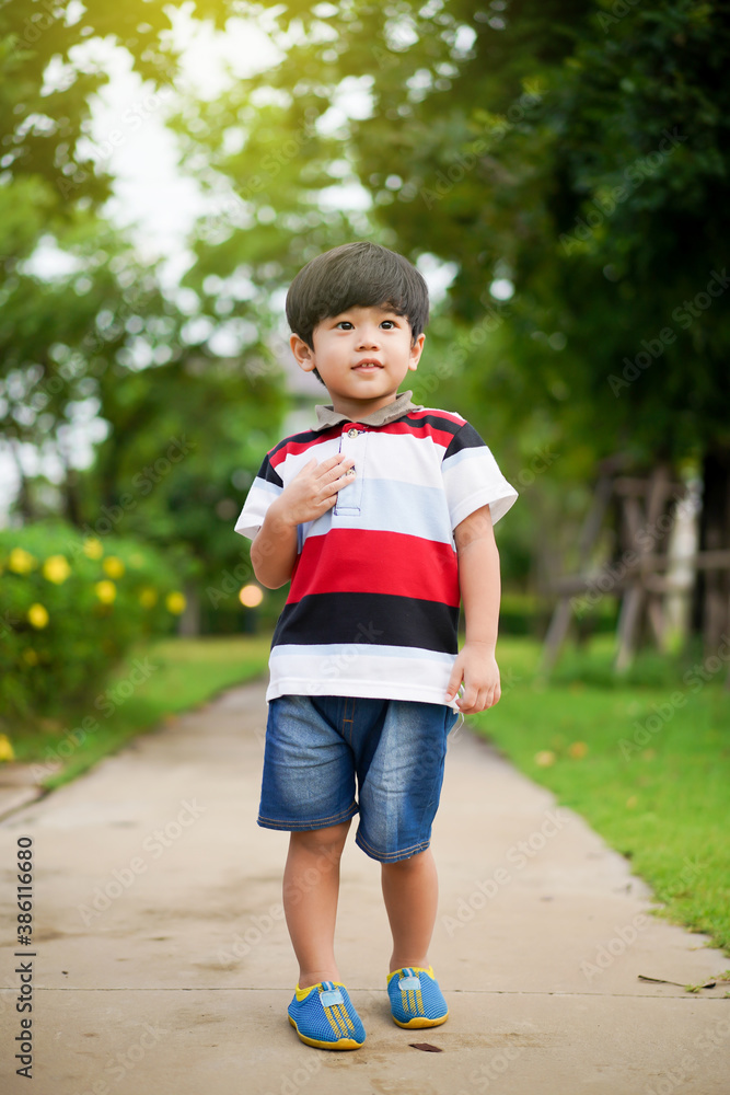 Playful Asian young boy enjoy playing at the park. Playful Asian young boy enjoy playing at the park.