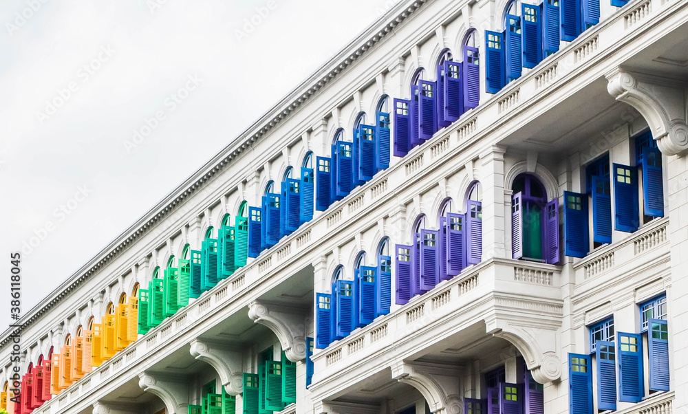 Rainbow coloured window frames on a facade Rainbow coloured window frames on a facade