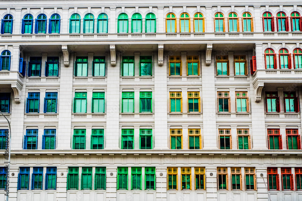 Fototapeta premium Rainbow coloured window frames on a facade