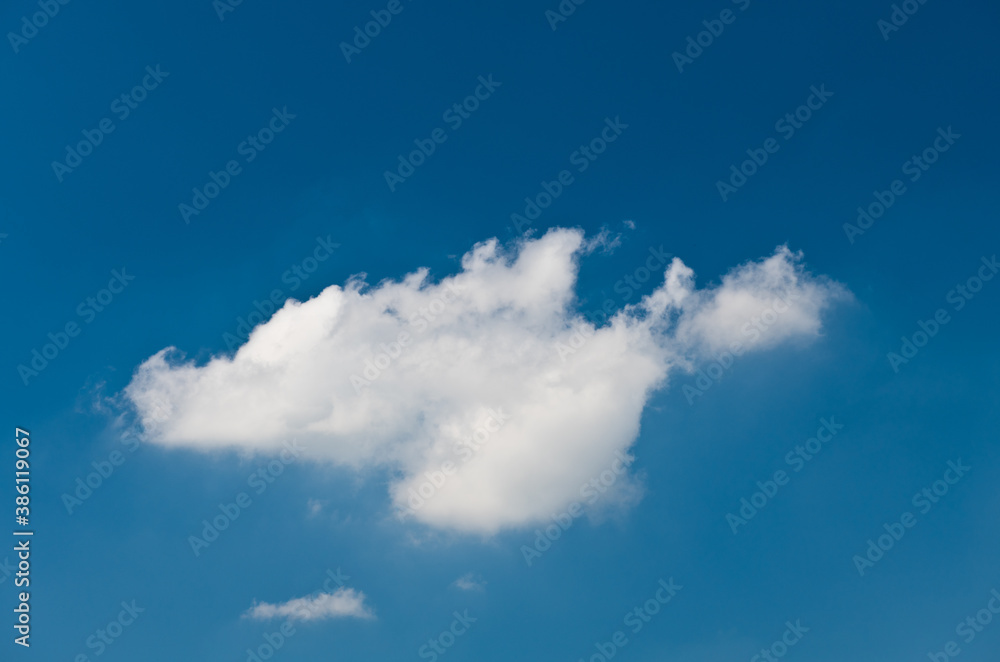 Large white fluffy cloud in the blue sky Large white fluffy cloud in the blue sky