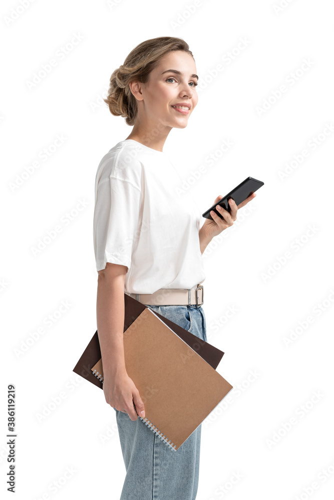 Smiling young businesswoman with smartphone