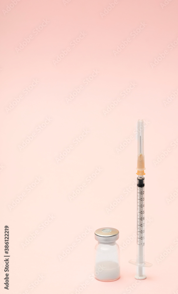 Syringe and ampules on pink background.Vaccination. Syringe and ampules on pink background.Vaccination.