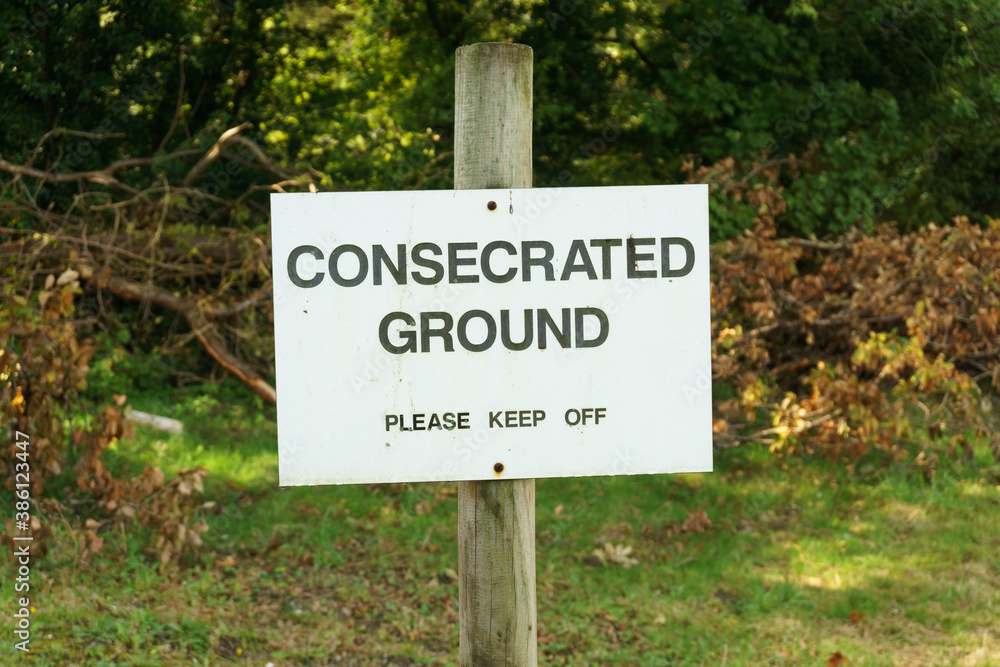 Consecrated ground sign at a cemetery implying it has been declared sacred or holy, and is can be used for Christian burial
