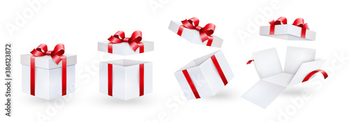 Gift box with red ribbon and bow. Different position of a festive white paper box.