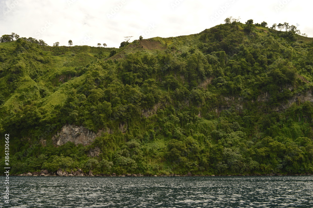 The lush jungle landscapes with waterfalls and black volcanic beaches on the St Vincent and Grenadines islands, Caribbean Ocean