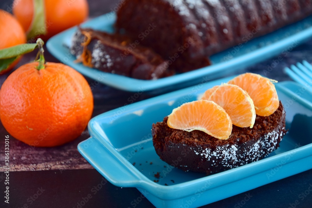 Chocolate almond clementine cake garnish with powdered sugar and zest Chocolate almond clementine cake garnish with powdered sugar and zest