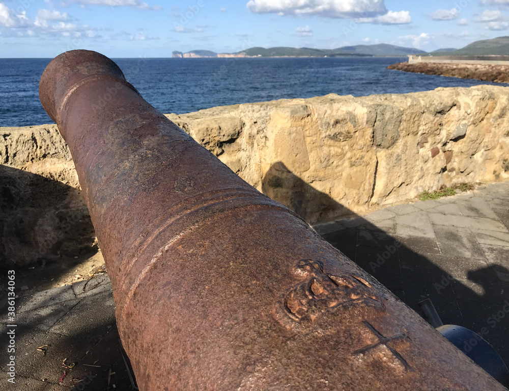 cannon on seafront bastions at alghero, sardinia, italy cannon on seafront bastions at alghero, sardinia, italy